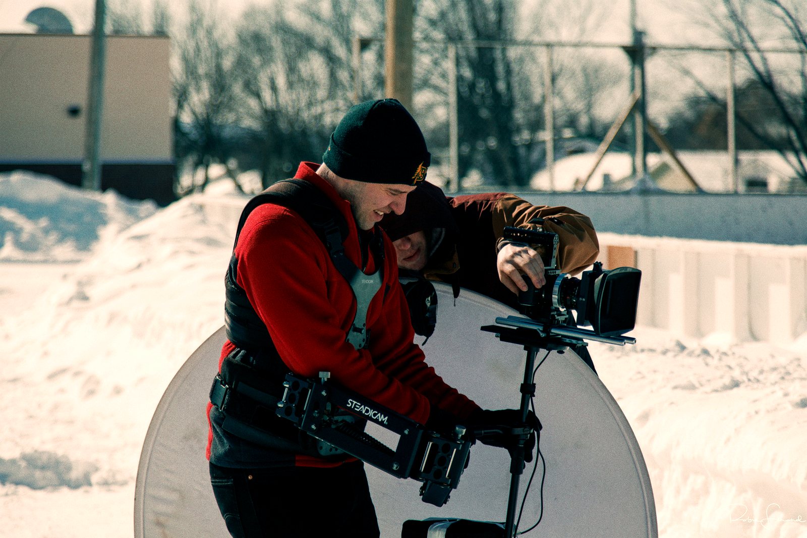 A Steadicam operator rigs up for the shot